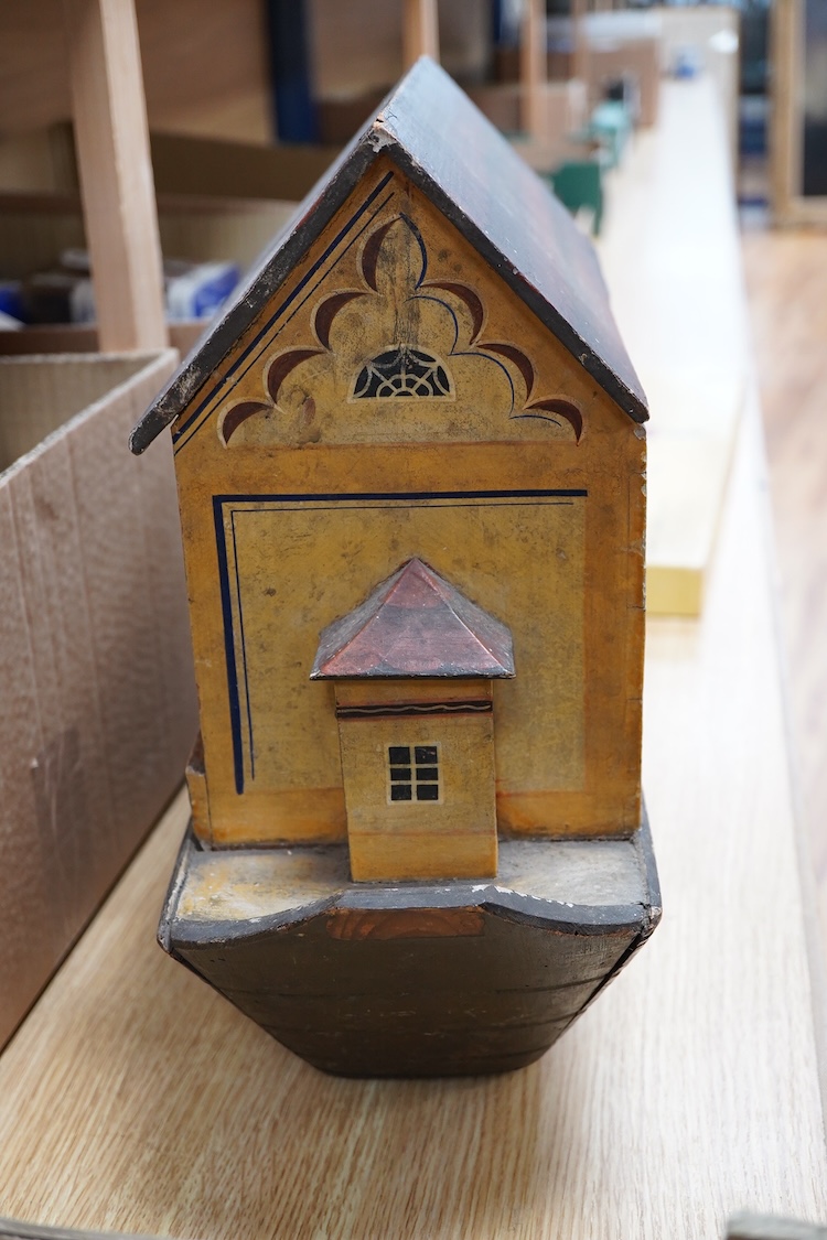 A 19th century German Erzgebirge pine painted Noah's Ark together with a good quantity of carved and painted wooden animals, the ark decorated with trompe l’oeil architectural features, geometric patterns, Gothic windows